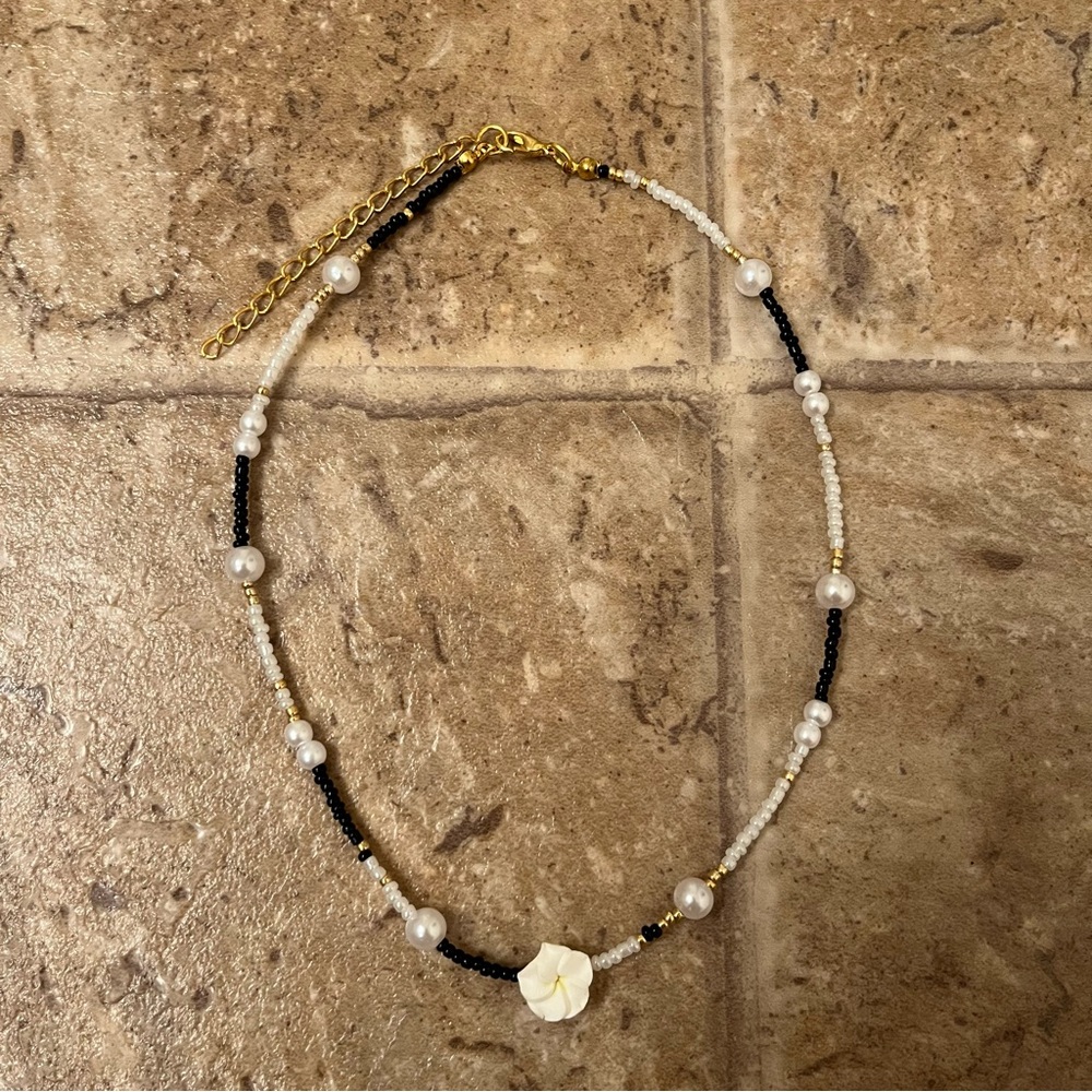 Black and white plumeria flower necklace